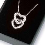 Celebrate a silver anniversary with our special necklace and let your wife know just how special she is. Two hearts joined together. Layered in silver Austrian Crystals